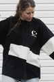 black long sleeve, featuring flahes of cream, made with scrap fabric, handmade in canada