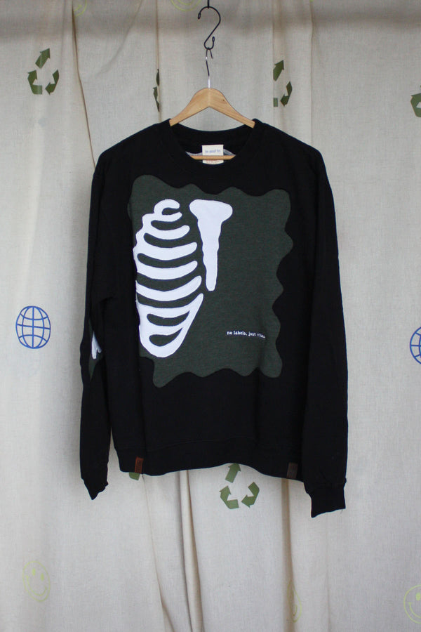 upcycled black crew with skeleton ribcage and arm bones, repurposed in canada