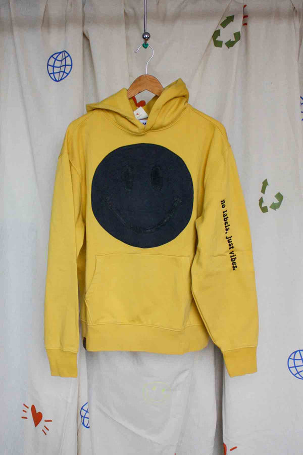 yellow hoodie with black smiley face on it, upcycled clothing