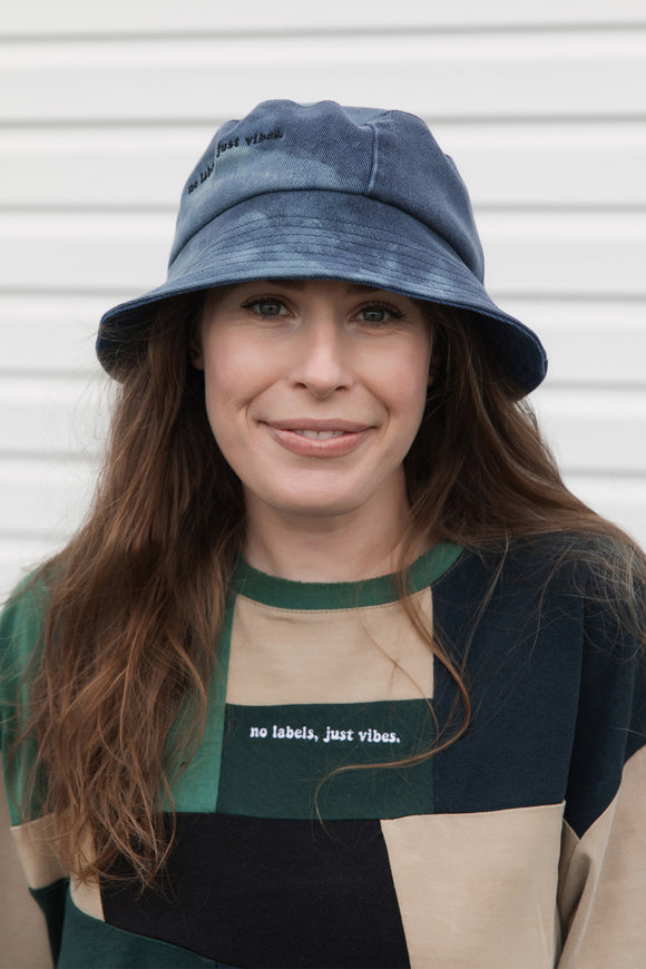 upcycled bucket hat, each one of a kind and embroidered with 'no labels, just vibes.' made in canada