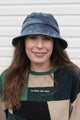 upcycled bucket hat, each one of a kind and embroidered with 'no labels, just vibes.' made in canada
