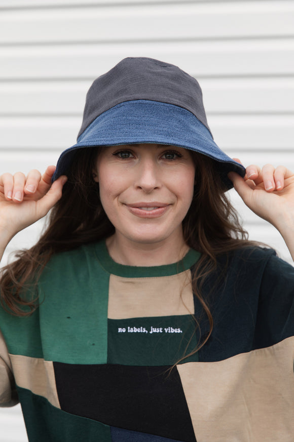 upcycled bucket hat, each one of a kind and embroidered with 'no labels, just vibes.' made in canada