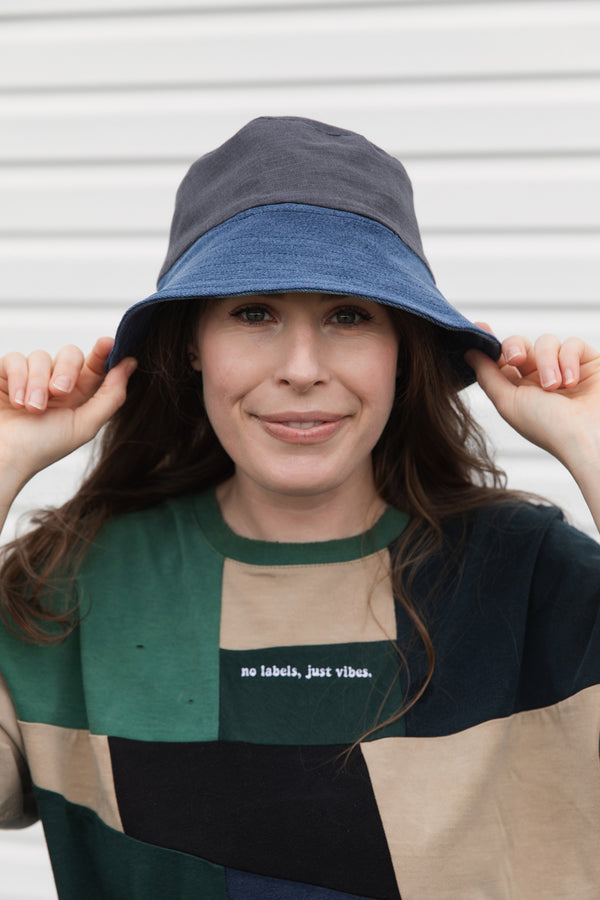 upcycled bucket hat, each one of a kind and embroidered with 'no labels, just vibes.' made in canada