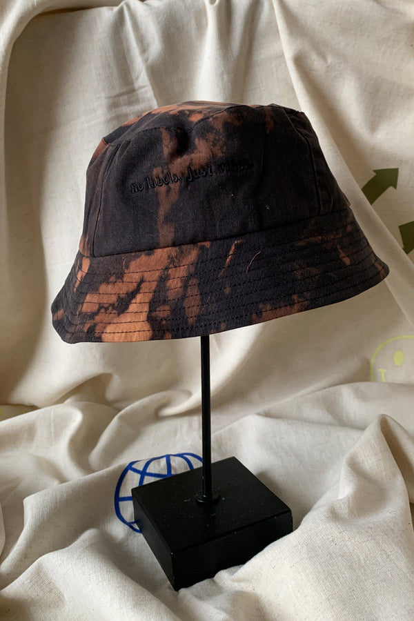 upcycled bucket hat, each one of a kind and embroidered with 'no labels, just vibes.' made in canada