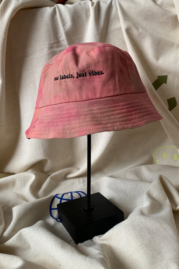 upcycled bucket hat, each one of a kind and embroidered with 'no labels, just vibes.' made in canada