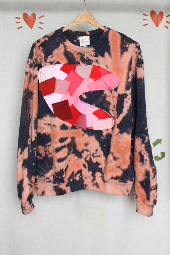 bleached crewneck with pink and red swatch motif, upcycled fabric, repurposed clothing made in ottawa