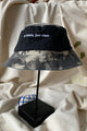 colourful upcycled bucket hat, each embroidered with 'no labels, just vibes.' and are reversible with solid colours, made in canada