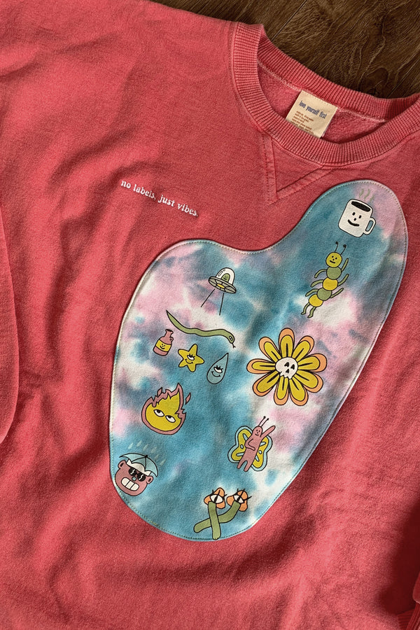 pink upcycled sweater with tie dyed front featuring cute drawings, repurposed in canada