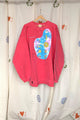 pink upcycled sweater with tie dyed front featuring cute drawings, repurposed in canada