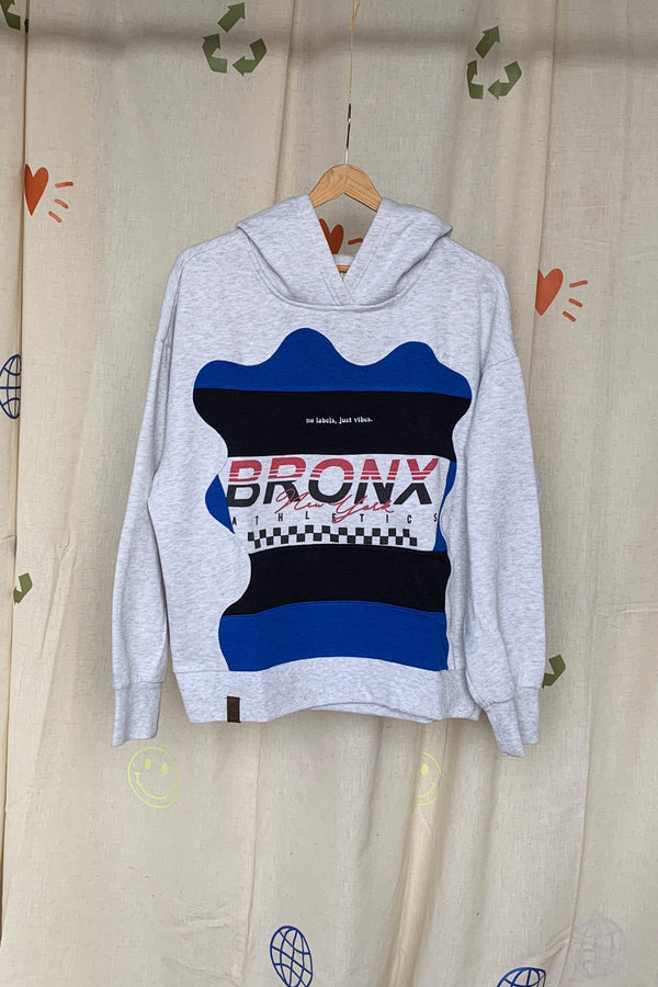 grey hoodie featuring bronx new york logo and blue and black colours, upcycled in canada