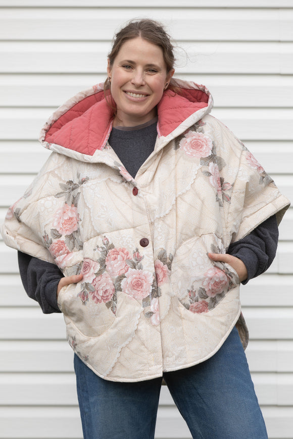 rose comforter upcycled into clare poncho, designed to be layered with all your fall outfits. made in canada
