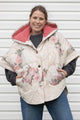 rose comforter upcycled into clare poncho, designed to be layered with all your fall outfits. made in canada