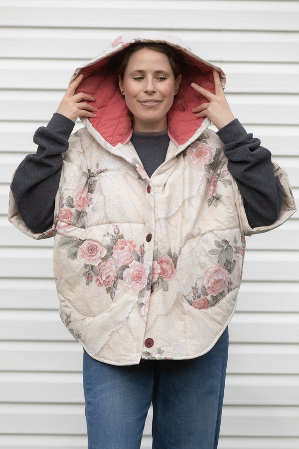rose comforter upcycled into clare poncho, designed to be layered with all your fall outfits. made in canada