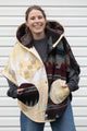 oversized upcycled quilted poncho, made from scrap fabric, yellow quilt with burgundy patterned fabric, repurposed in canada