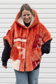 plush orange floral blanket upcycled in to stunning oversized poncho featuring a hood, pockets and button up front, repurposed in canada