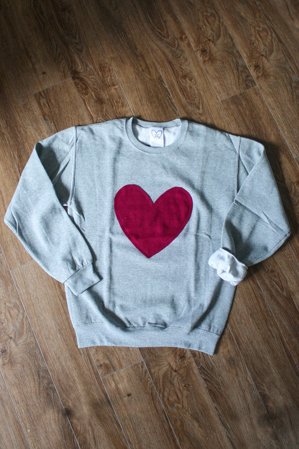 heather grey oversized sweater with cranberry heart applique, upcycled fabric, recycled fabric, handstitched in Ottawa