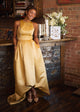 pleated gold satin gown with high low hem and pockets custom made in Toronto