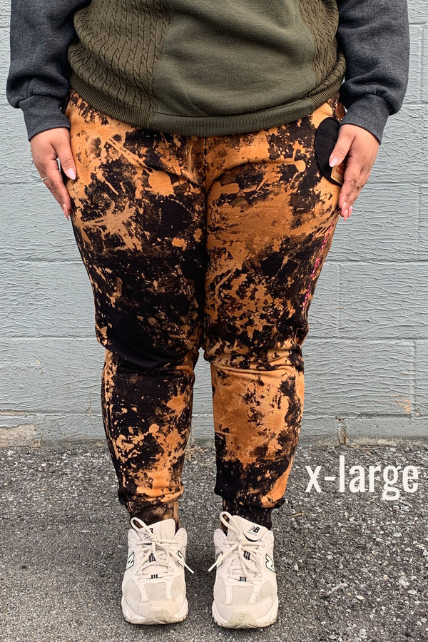 bleached joggers with pink embroidery, upcycled in canada