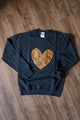 faux leather leopard print heart on a black sweater, unisex and oversized, sewn in canada