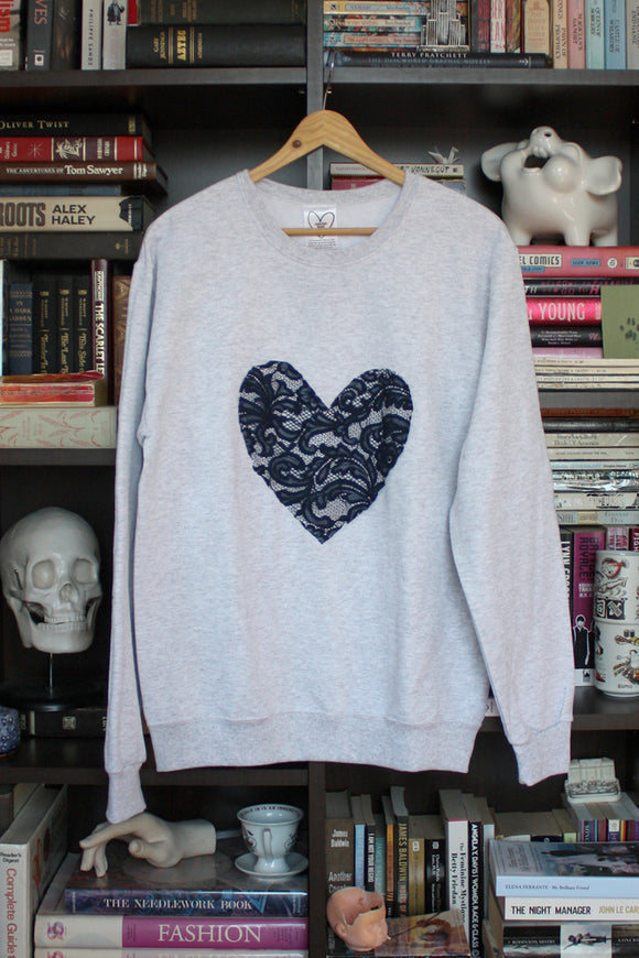 navy lace heart, white sweater, athletic sweater, hand stitched in Ottawa, recycled fabric, upcycled