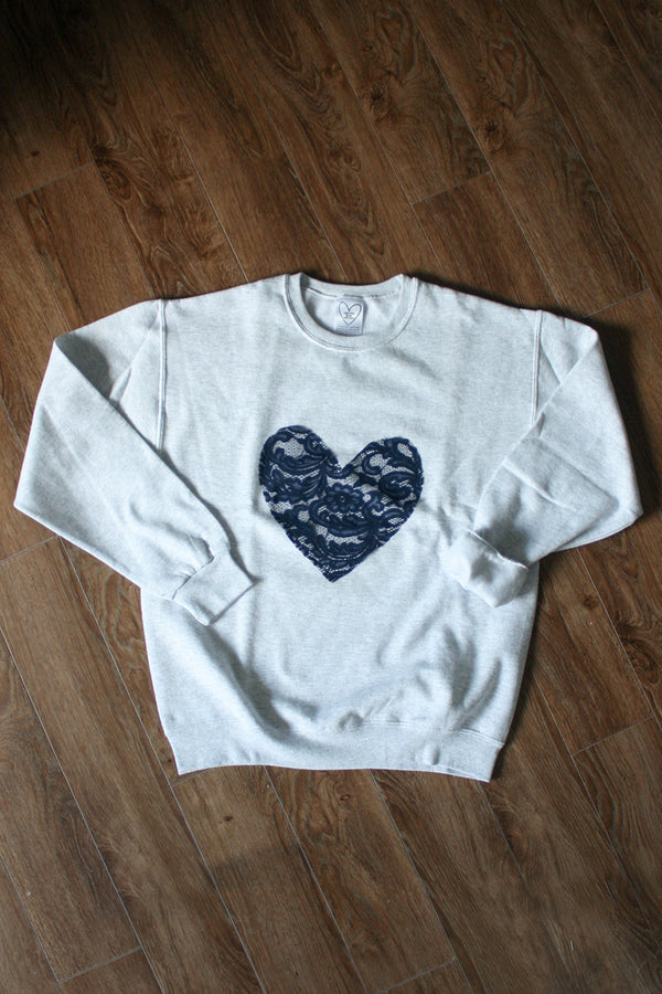 navy lace heart, white sweater, athletic sweater, hand stitched in Ottawa