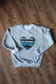 Indigenous woven blue heart sewn on heather grey sweater, unisex and oversized fit, sewn in canada