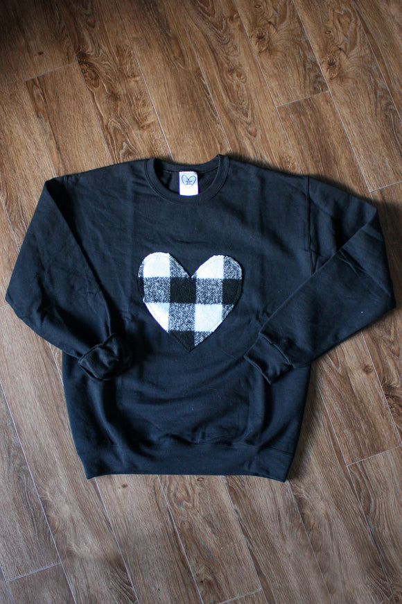 black athletic sweater with white and black checked heart, heart sweater, winter cozy sweater, recycled fabric, handmade in Ottawa